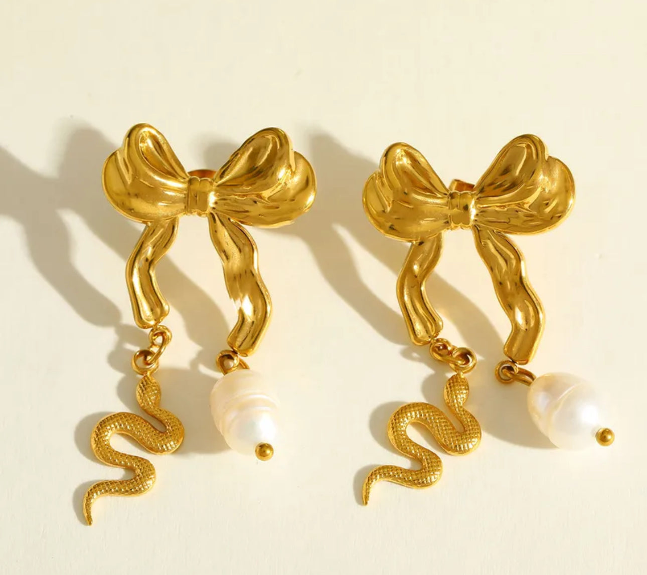 Stainless steel 18k bow with pear and snake earrings